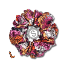 Load image into Gallery viewer, A large colourful scrunchie. A rose pattern in the colours of the Lesbian pride flag. White, orange and pink. Approximately 12cm in Diameter.