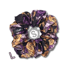 Load image into Gallery viewer, A large colourful scrunchie. A rose pattern in the colours of the Nonbinary pride flag. White, black, yellow and purple. Approximately 12cm in Diameter.