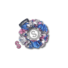 Load image into Gallery viewer, A small colourful scrunchie. A rose pattern in the colours of the trans pride flag. Blue, white and pink. Approximately 8cm in Diameter.