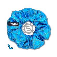 Load image into Gallery viewer, A large blue scrunchie, covered in metallic blue scales. Approximately 12cm in Diameter.