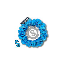 Load image into Gallery viewer, A small blue scrunchie, covered in metallic blue scales. Approximately 8cm in Diameter.