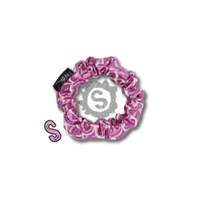 Load image into Gallery viewer, A small light pink scrunchie, covered in metallic pink scales. Approximately 8cm in Diameter.