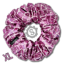 Load image into Gallery viewer, An extra large light pink scrunchie, covered in metallic pink scales. Approximately 15cm in Diameter.