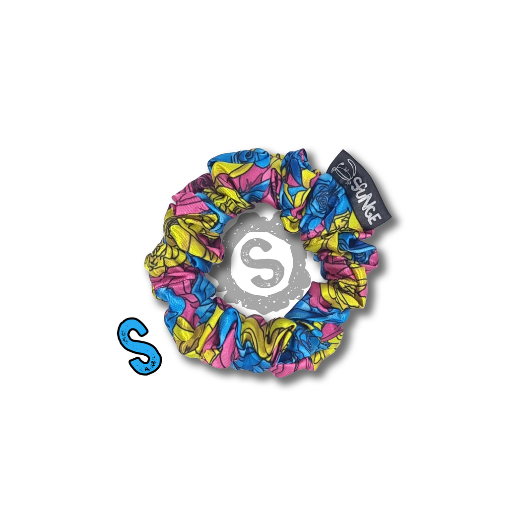 A small colourful scrunchie. A rose pattern in the colours of the Pansexual pride flag. Blue, pink and yellow. Approximately 8cm in Diameter.