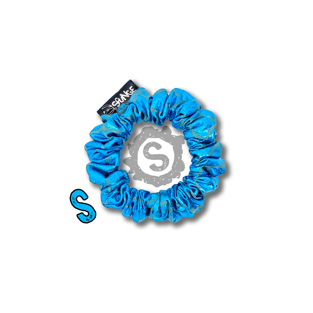 A small blue scrunchie, covered in metallic blue scales. Approximately 8cm in Diameter.