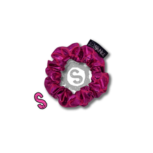 Load image into Gallery viewer, A small hot pink scrunchie, covered in metallic pink scales. Approximately 8cm in Diameter.
