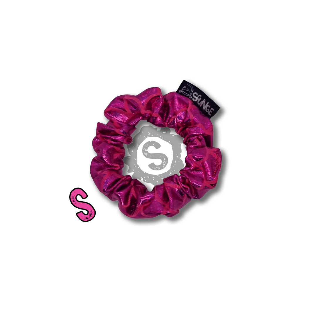 A small hot pink scrunchie, covered in metallic pink scales. Approximately 8cm in Diameter.