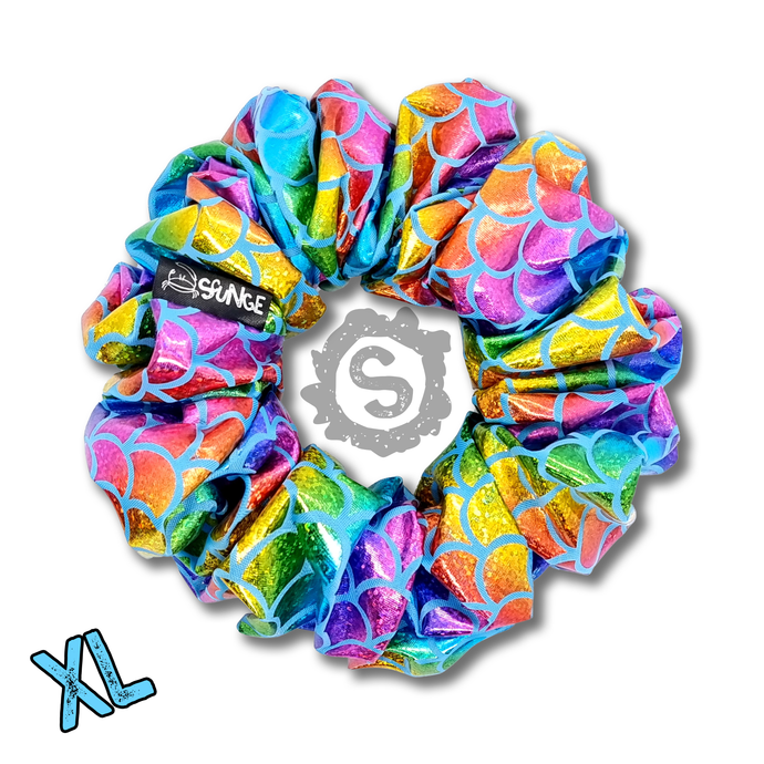 An extra large colourful scrunchie, covered in metallic rainbow scales. Approximately 15cm in Diameter.